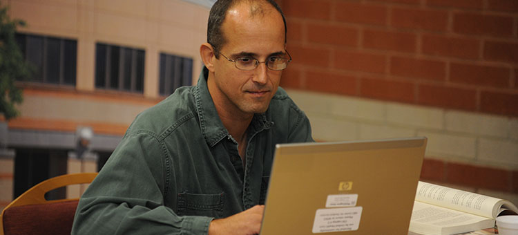 WSCC Student sitting in front of computer studying