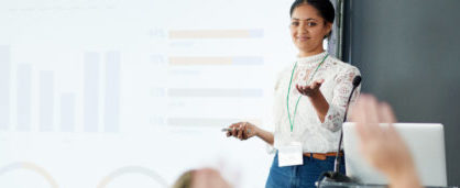 Shot of a young businesswoman delivering a presentation at a conference